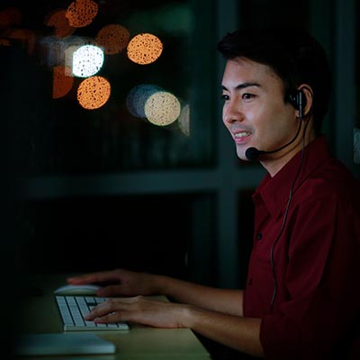 Customer service representative providing after-hours support via an answering service.