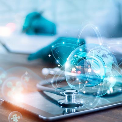 Digital graphic of a glowing globe and stethoscope resting on a tablet, representing virtual healthcare and global medical connectivity.